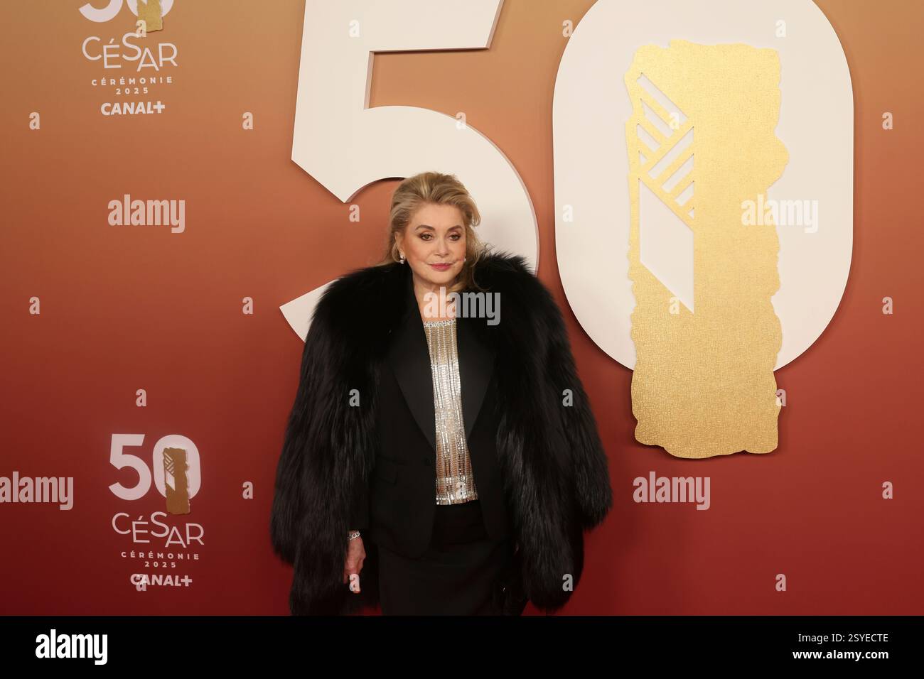 Catherine Deneuve poses as she arrives at the 50th Cesar Awards ...