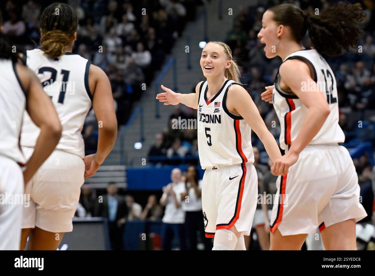 UConn's Paige Bueckers (5) reaches to slap hands with teammate Sarah ...