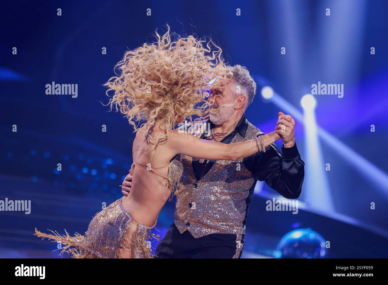 Cologne, Germany. 28th Feb, 2025. Roland Trettl, presenter, and Kathrin ...