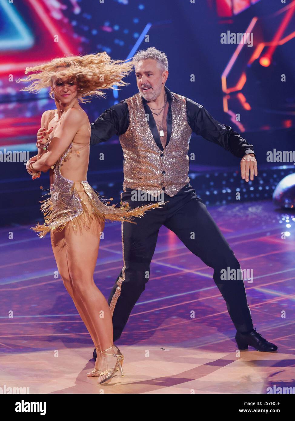 Cologne, Germany. 28th Feb, 2025. Roland Trettl, presenter, and Kathrin ...