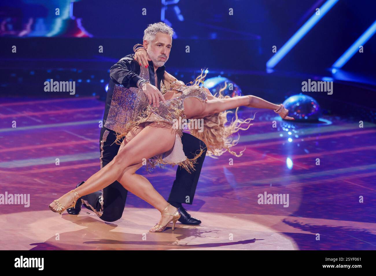 Cologne, Germany. 28th Feb, 2025. Roland Trettl, presenter, and Kathrin ...