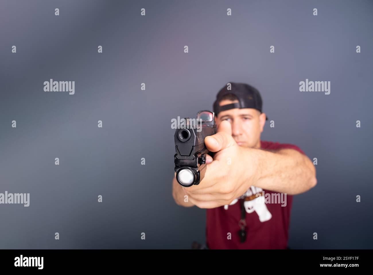 Holding gun by side hi-res stock photography and images - Alamy, image size:1300x957
