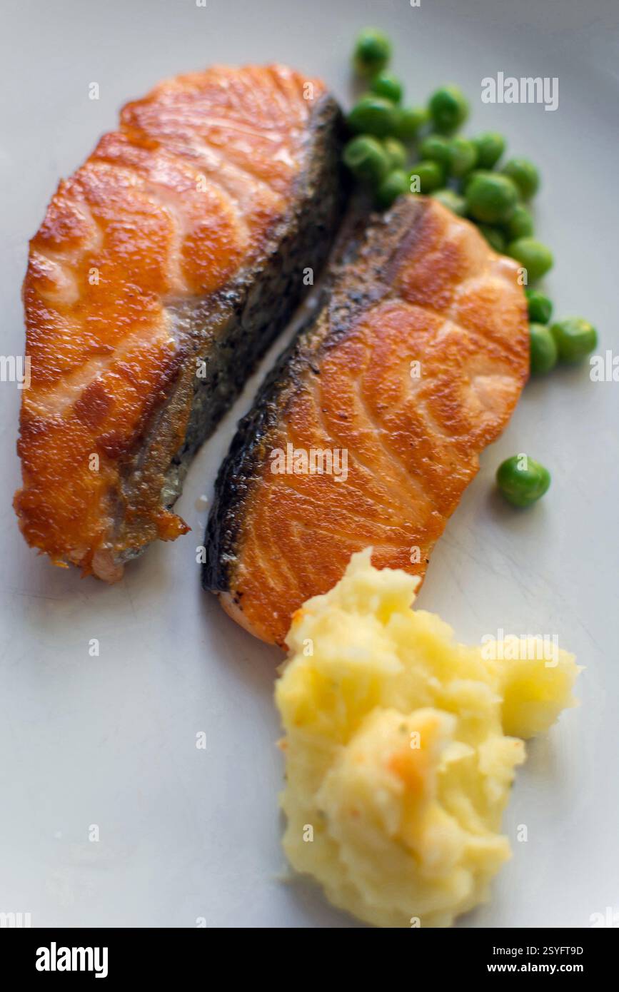 Steak salmon fish on white dish at Thai hotel Stock Photo - Alamy