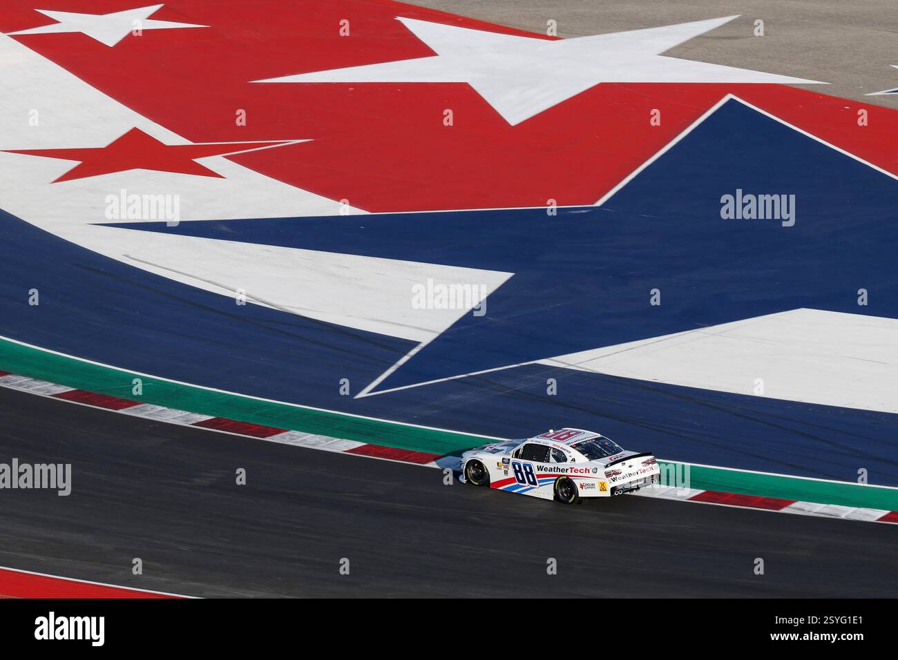 AUSTIN, TX - FEBRUARY 28: =88= speeds through turn three with the red ...