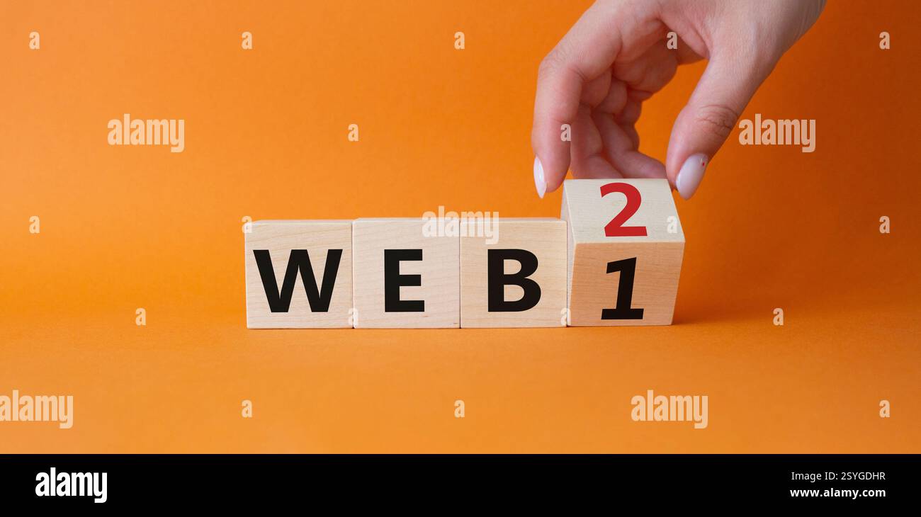 WEB 2 or WEB 1 symbol. Businessman hand Turnes cube and changes word ...