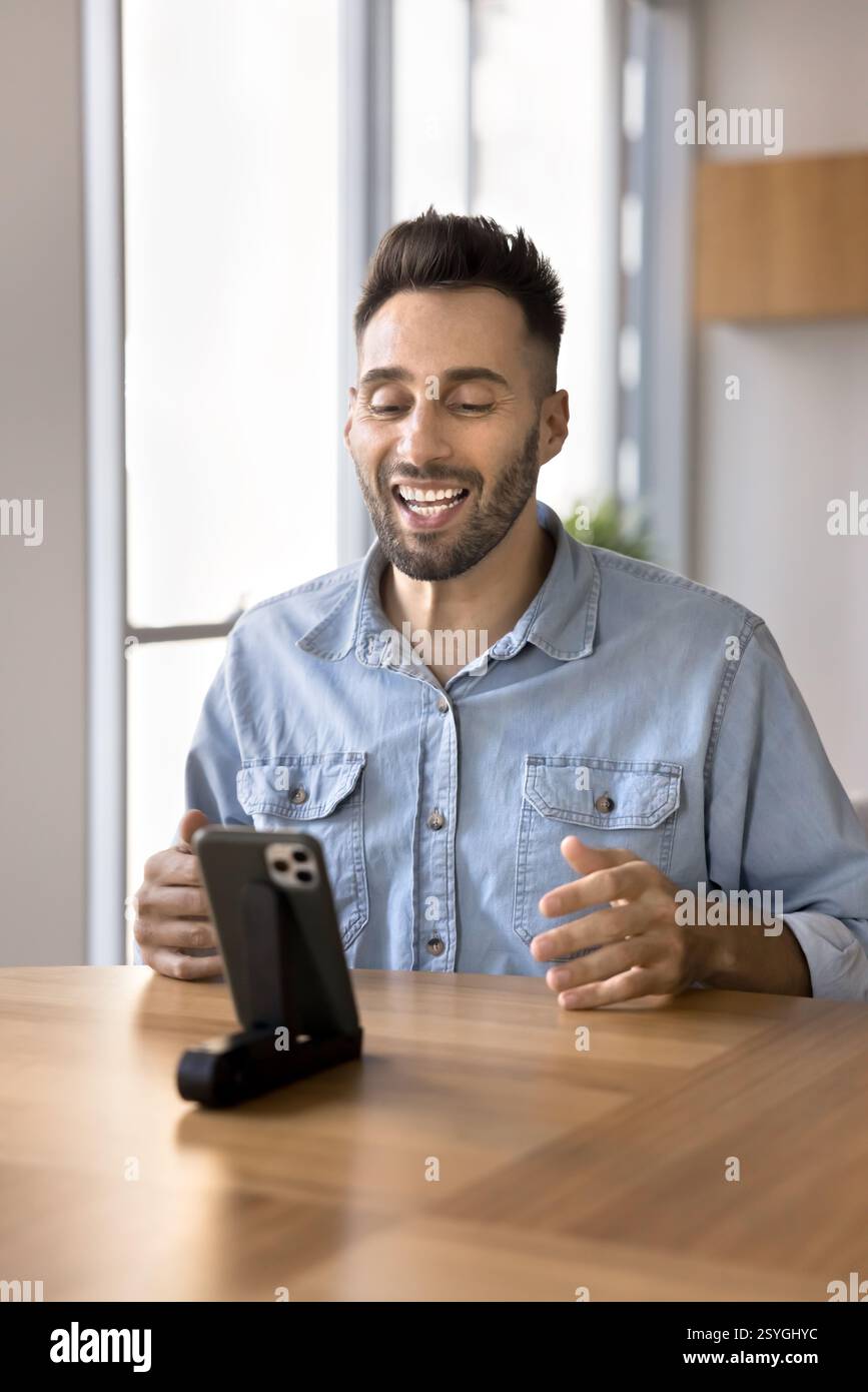 Man recording new video for channel using smartphone Stock Photo