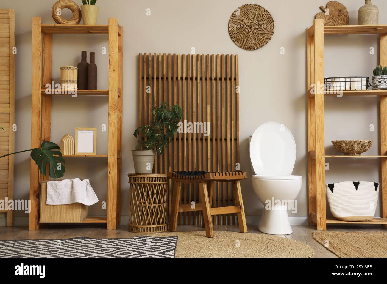 Interior of restroom with toilet bowl, tables and shelf units Stock ...