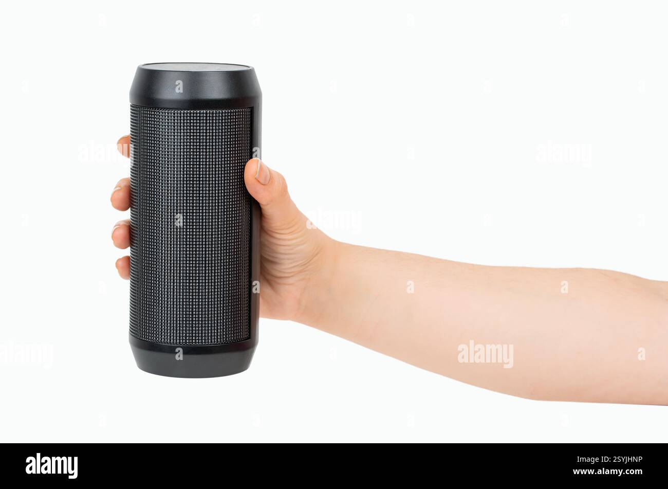 Portable wireless speaker in hand isolated on white background. Black mobile wireless bluetooth speaker with ribbed texture in female hand. Case made Stock Photo
