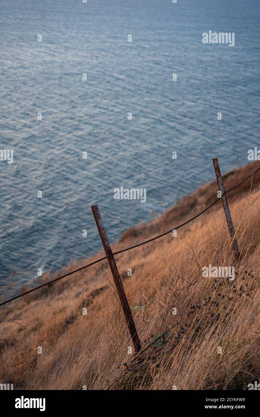 Old fence stretching across barren patterned dry field Stock Photo - Alamy