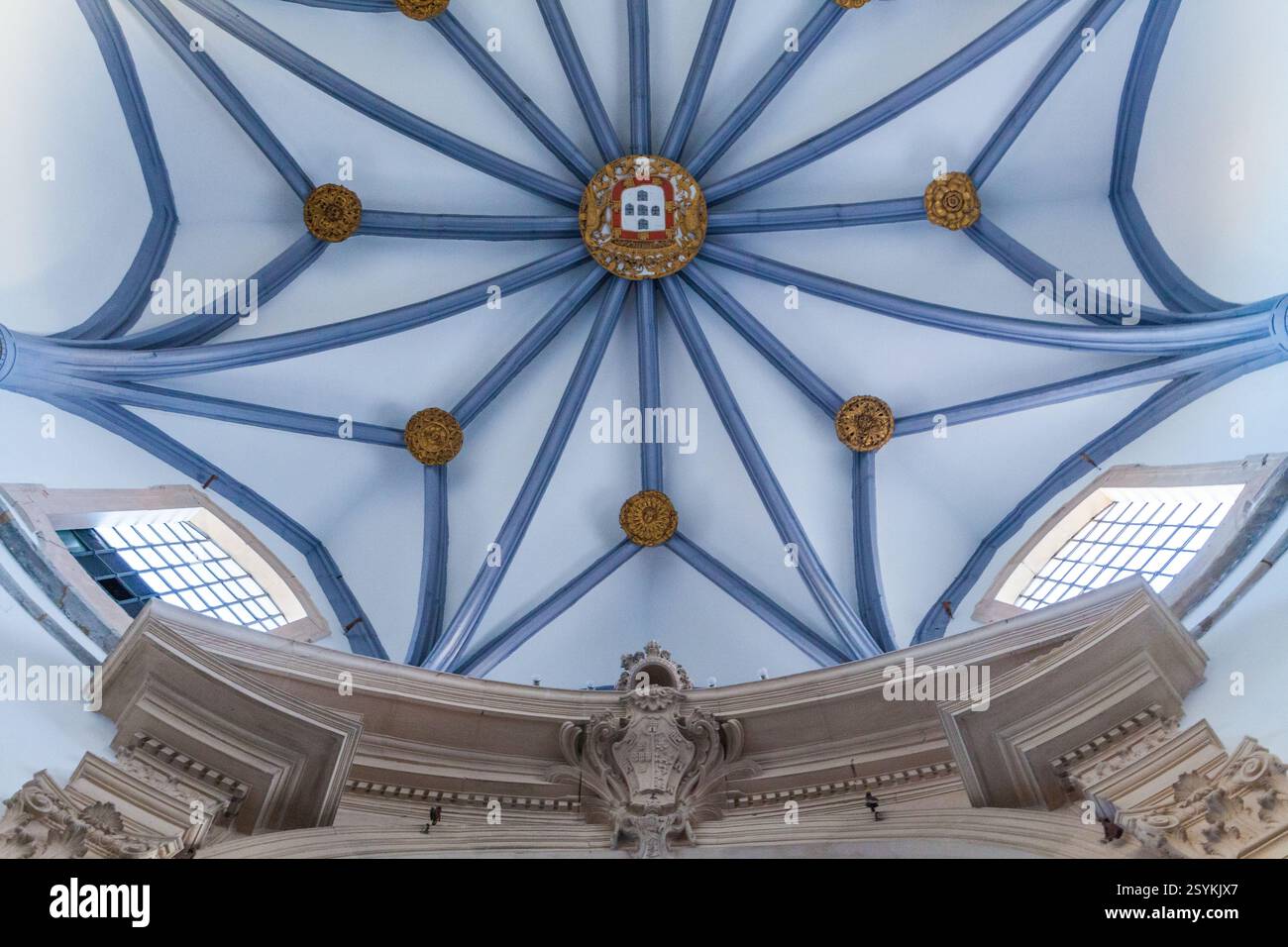 An intricate vaulted ceiling with a star-shaped pattern, featuring blue ...
