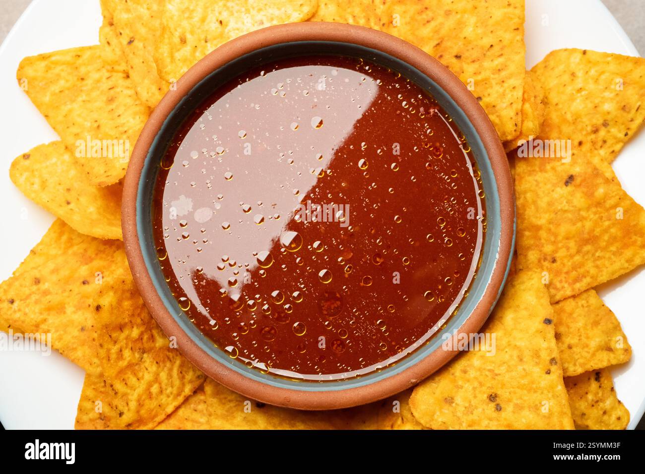 nachos and tomato salsa dip close up Stock Photo