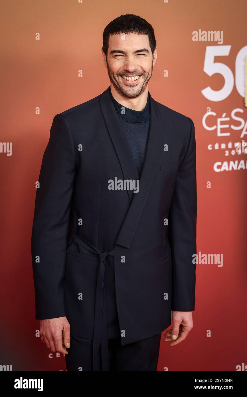 Tahar Rahim poses for photographers during the 50th Cesar Awards ...