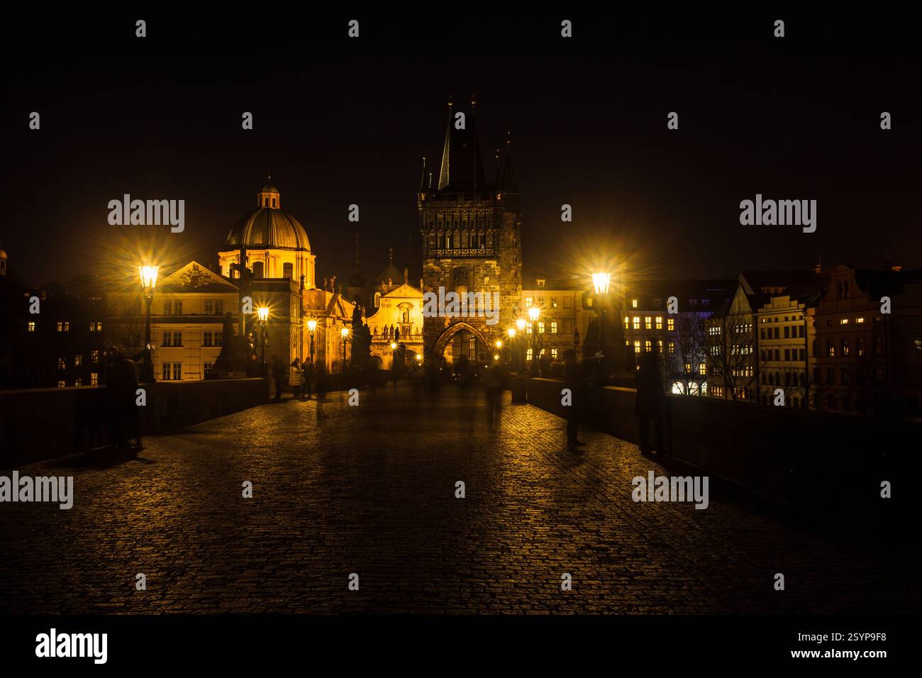 Night photo of Charles Bridge in Prague , Czech Republic. The world famous Prague landmark with beautiful lightening. Long exposure Stock Photo