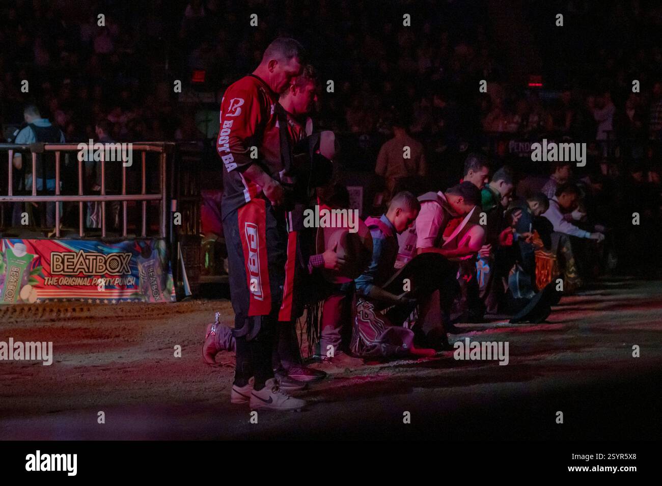 Bull riders pray during the opening ceremony for debut Professional ...