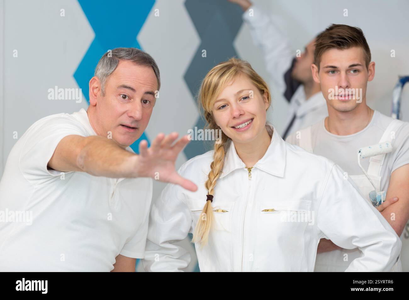 painter with apprentice and client Stock Photo