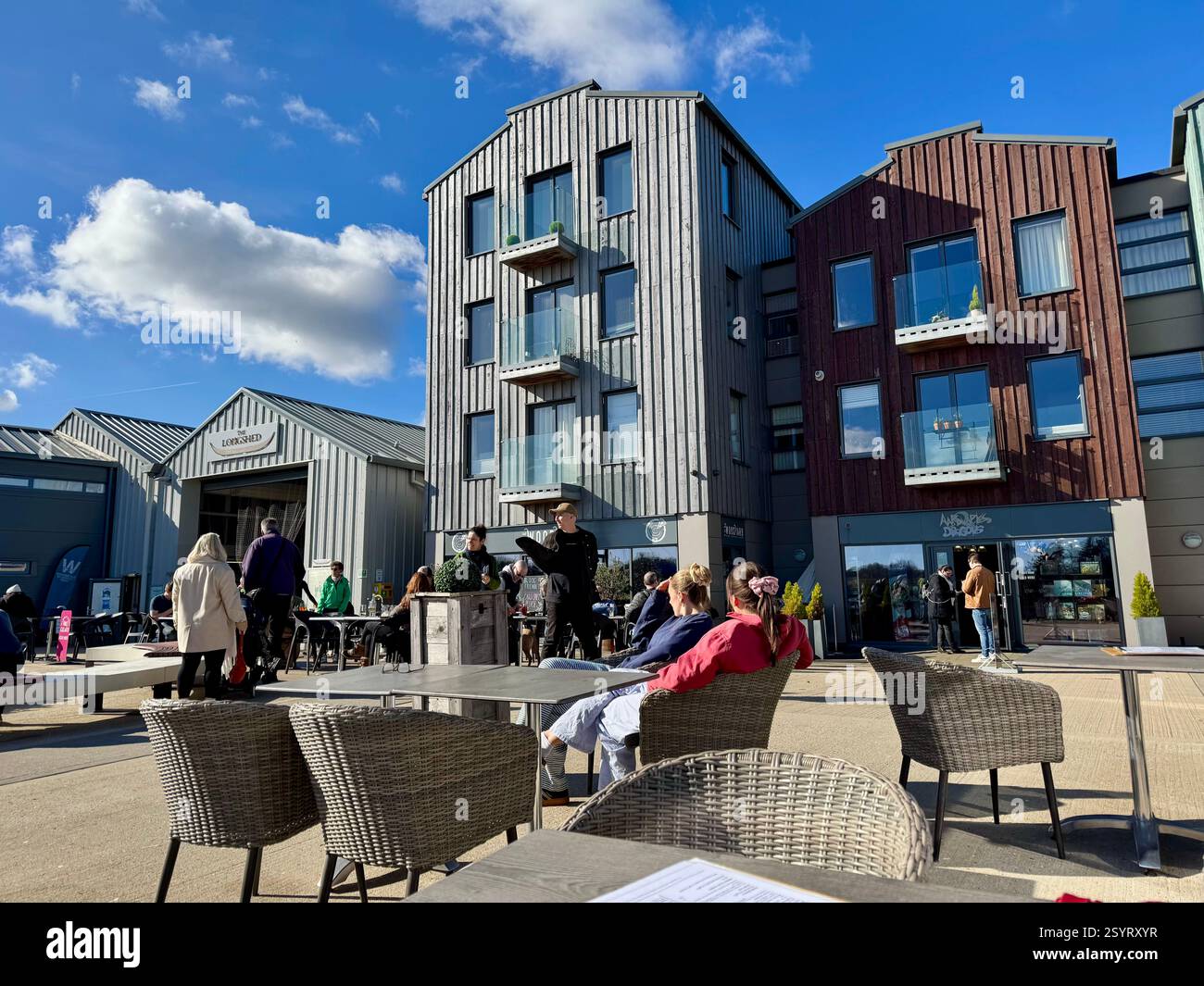 Woodbridge, Suffolk, 1 March 2025 : Bright sunny Saturday lunch time at Whisstocks yard. Woodbridge was recently dubbed Happiest town in England. - Smartphone Captured Stock Image