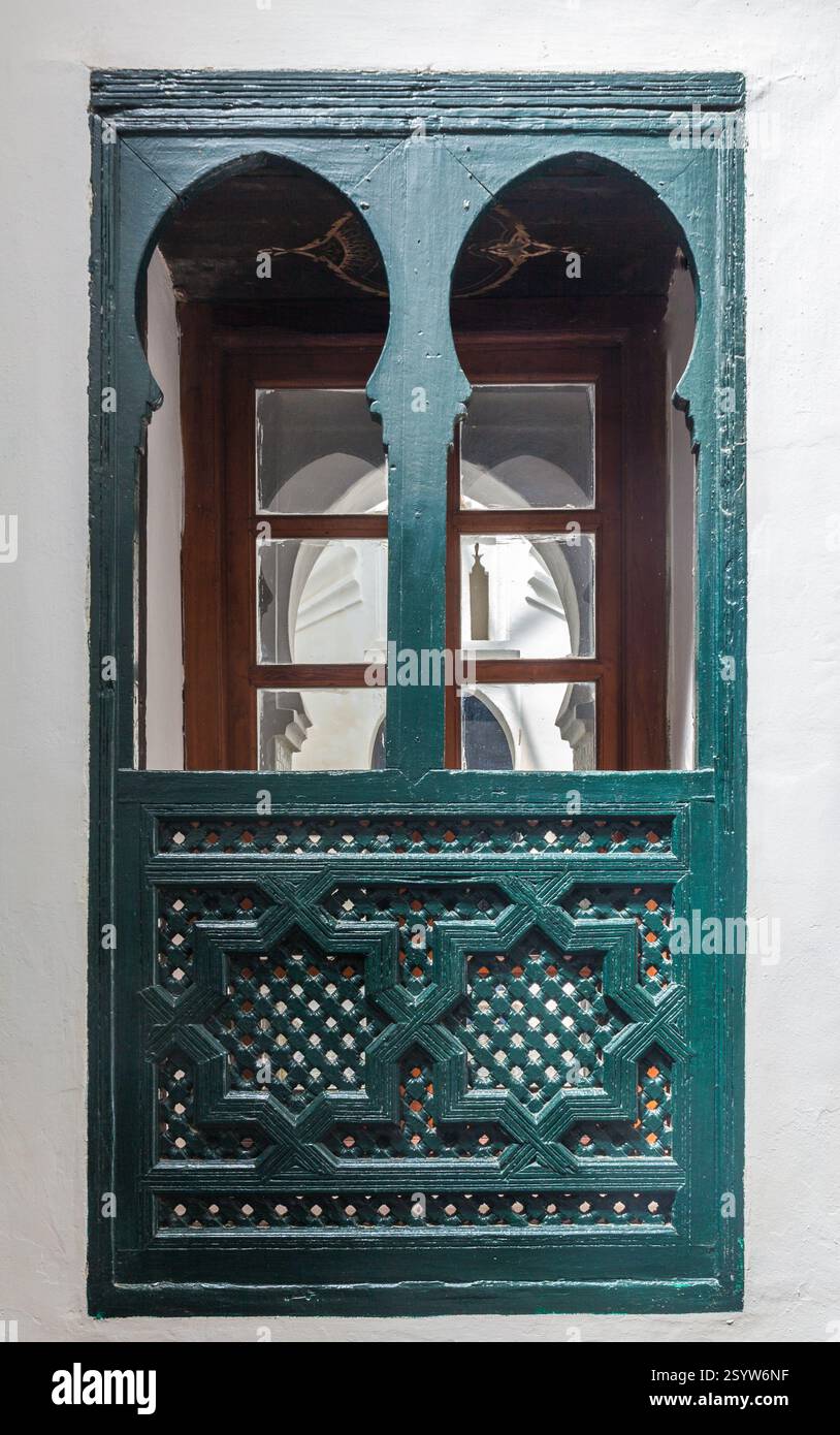 beautifully crafted window with intricate wooden latticework and a ...