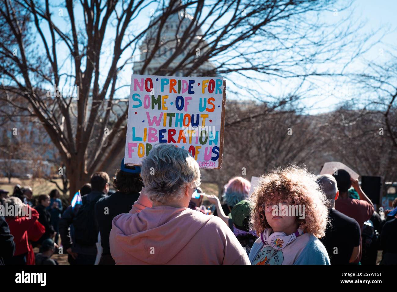 Washington, United States. 01st Mar, 2025. A protester holds a placard ...