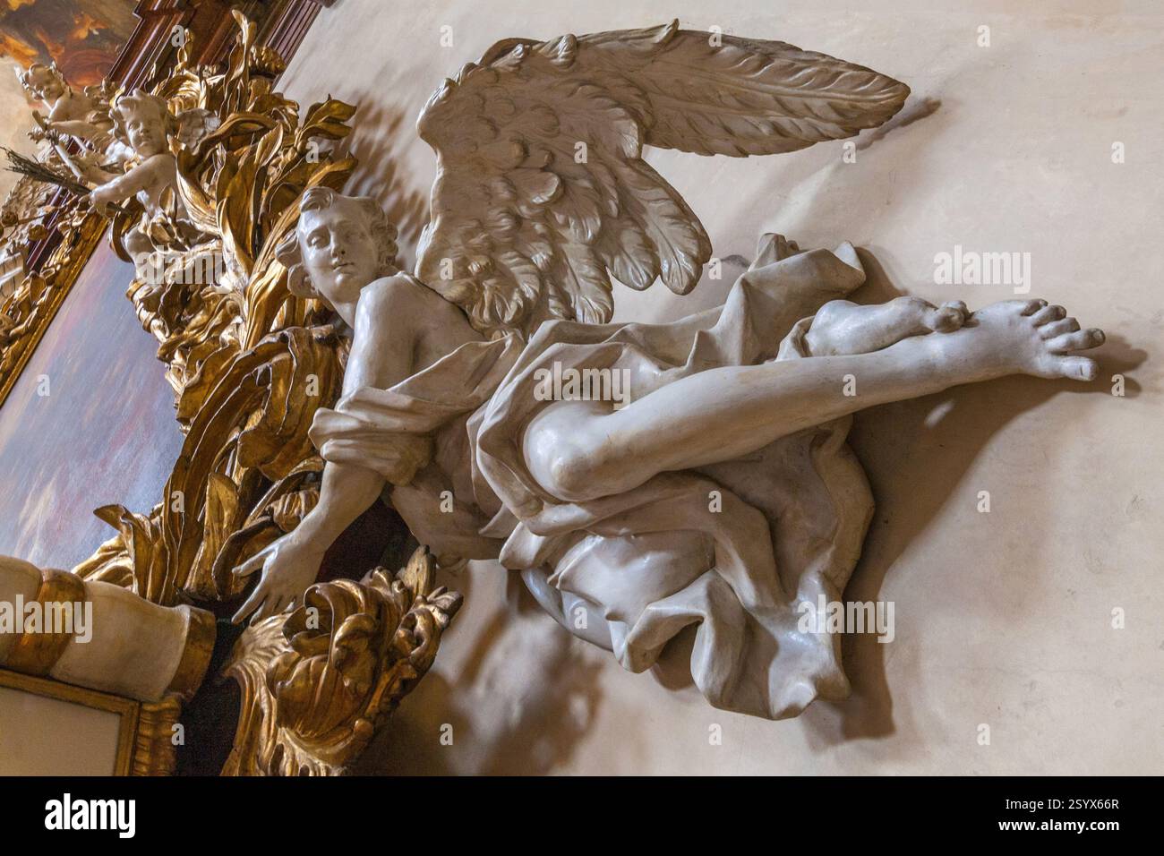 Angel Features A close-up of a sculpted angel with outstretched wings, positioned as a ...
