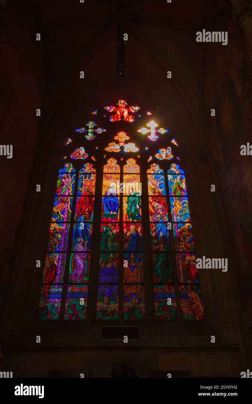 A vibrant stained glass window with intricate designs and figures ...