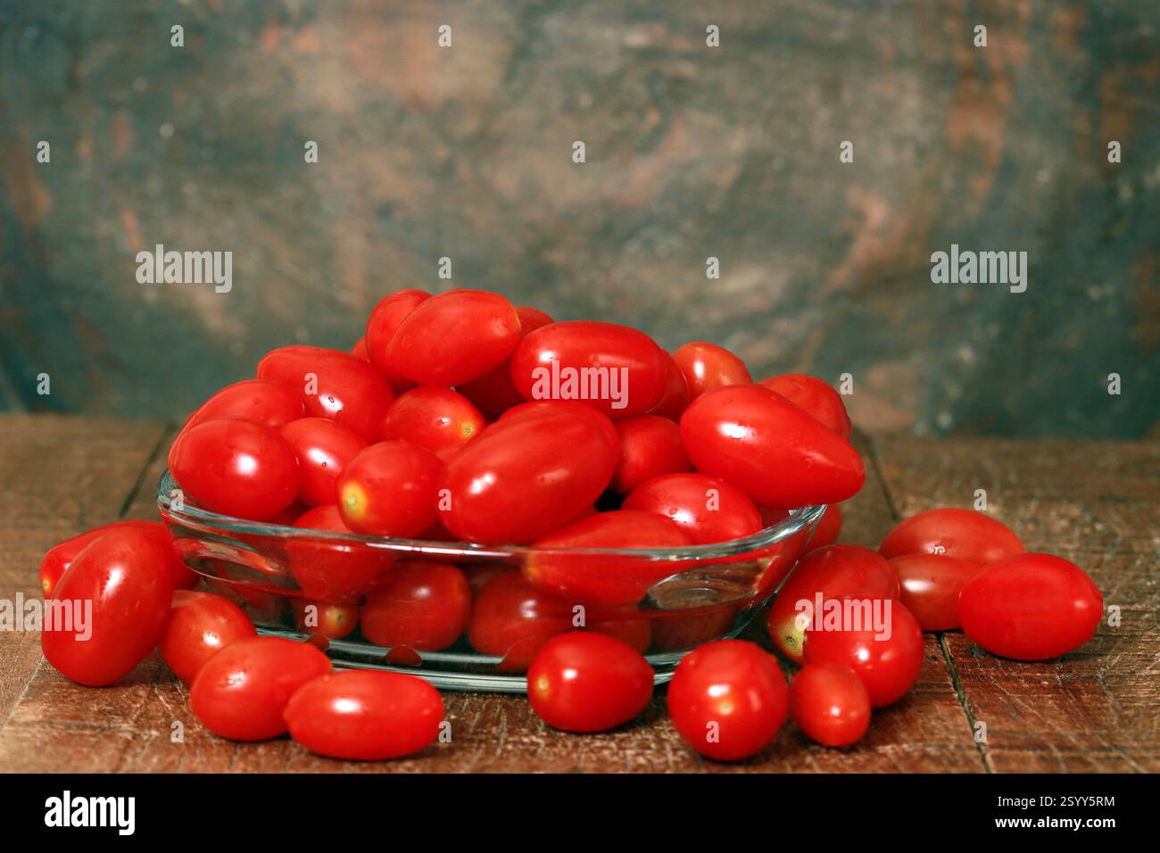 Fresh red tomato cherry in a glass bowl Stock Photo - Alamy