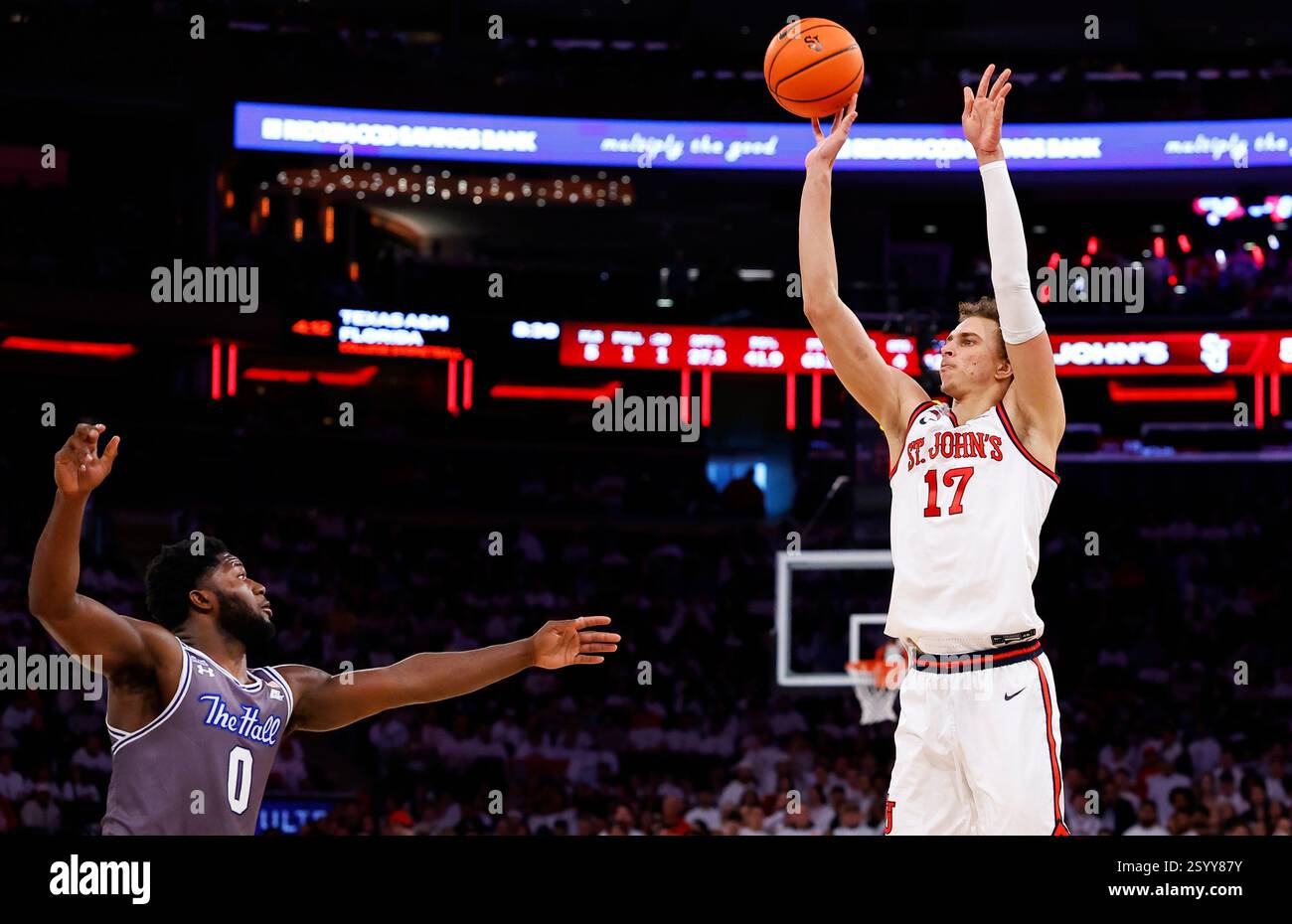 St John s Forward Ruben Prey 17 Makes A 3 point Shot Over Seton Hall st-john-s-forward-ruben-prey-17-makes-a-3-point-shot-over-seton-hall