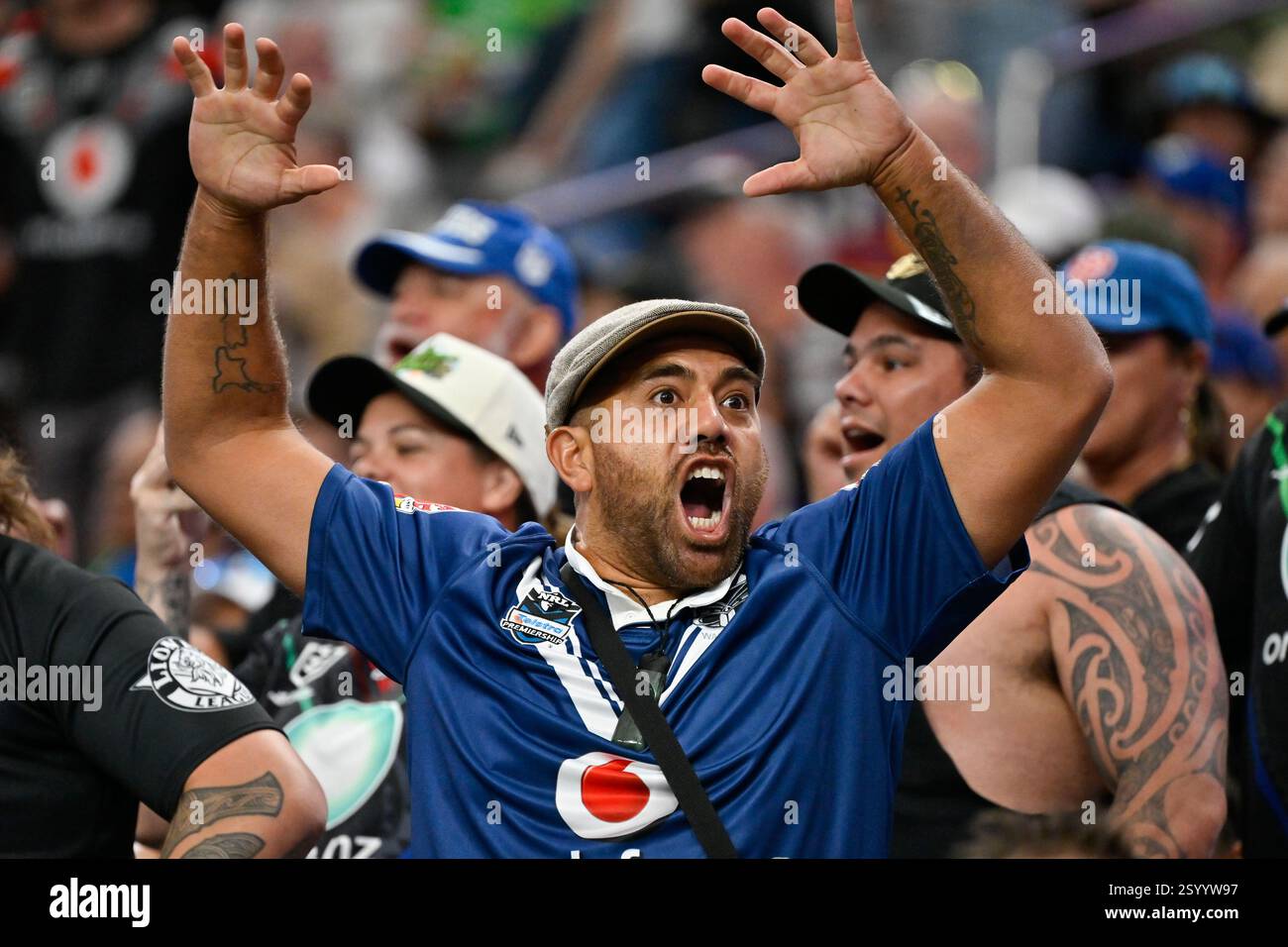 A New Zealand Warriors fan reacts during the opening match of Australia ...