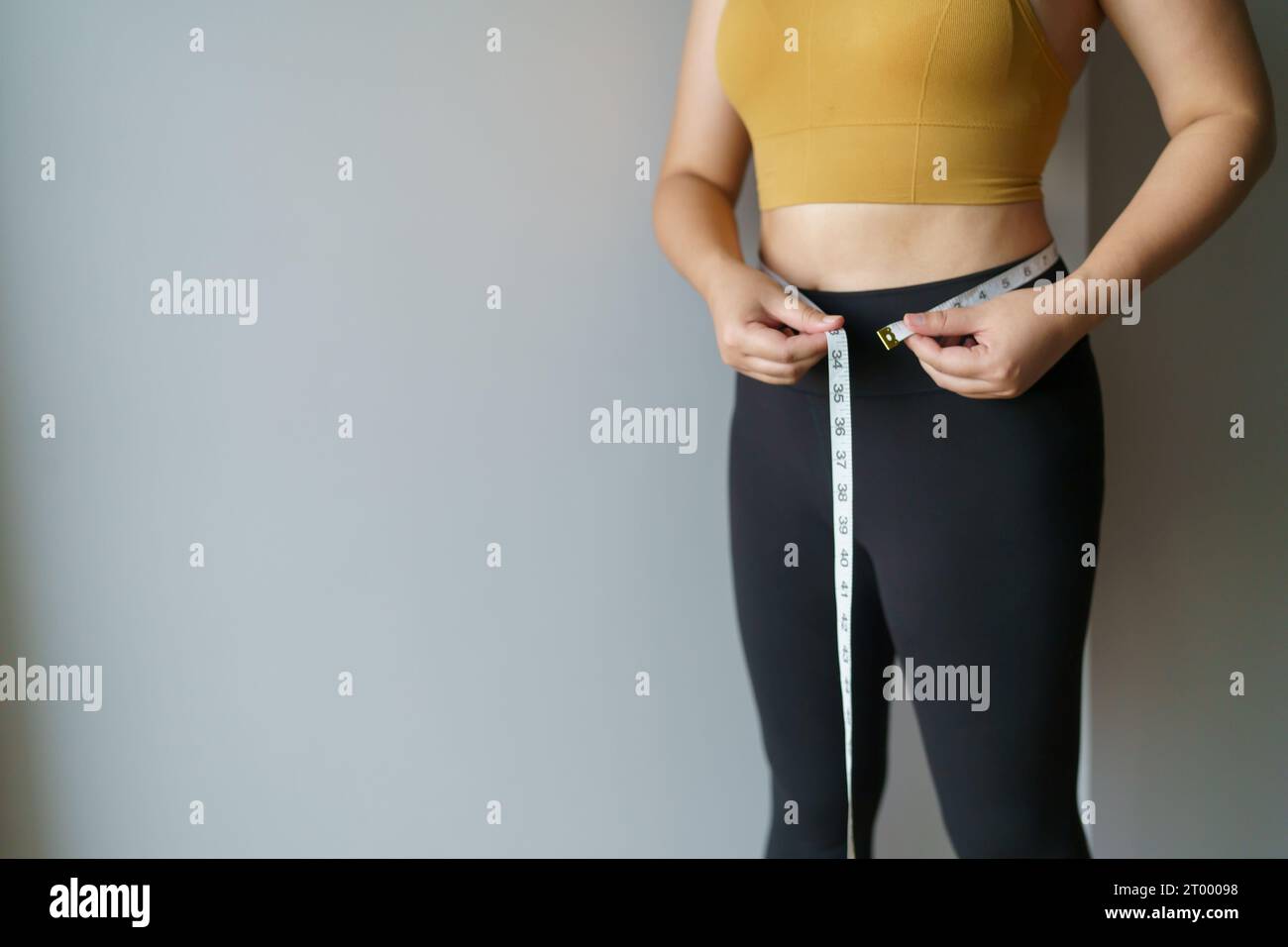 Woman want to lose weight with a centimeter Shape up healthy stomach
