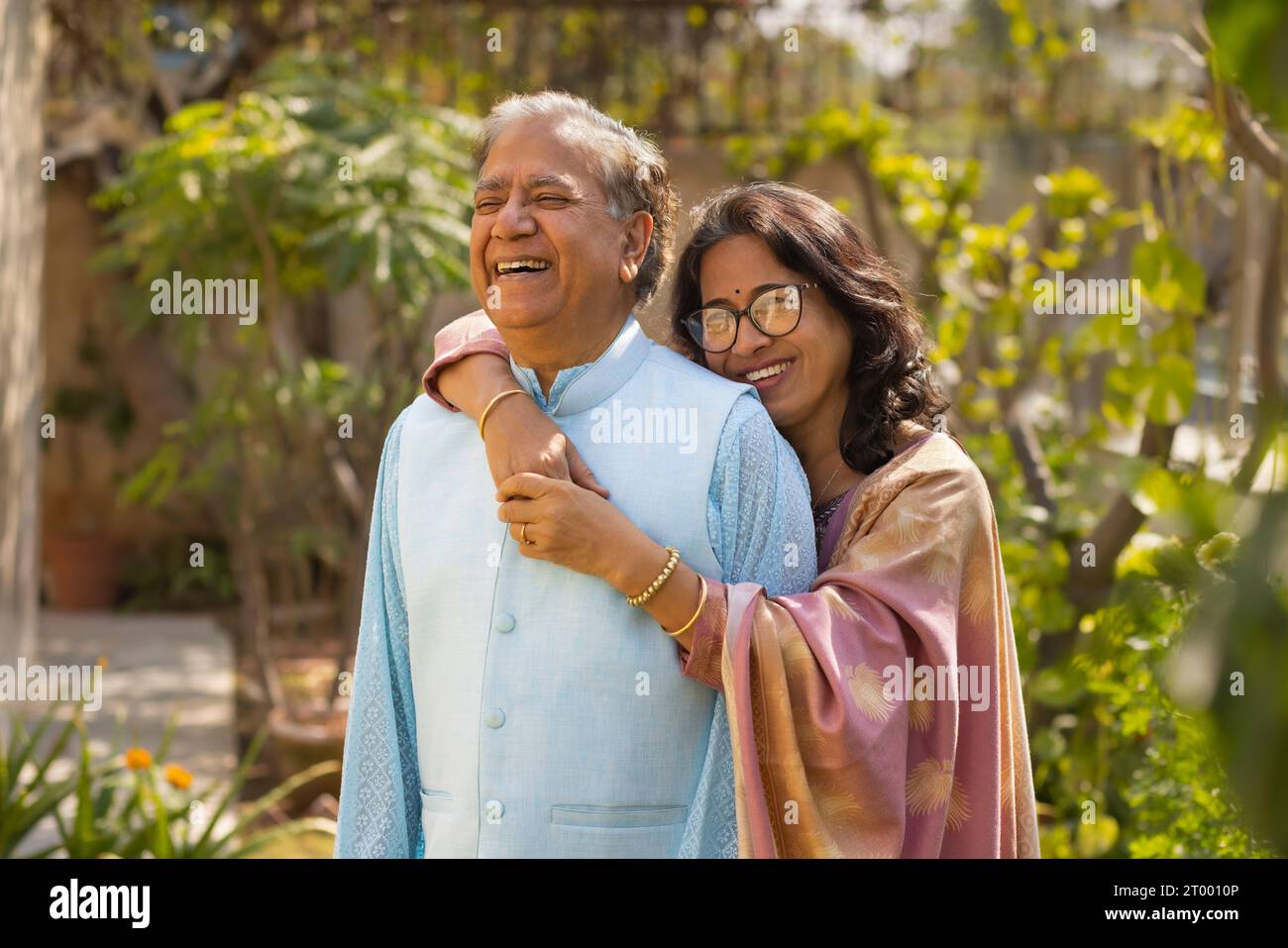Portrait of Mature couple embracing in garden Stock Photo