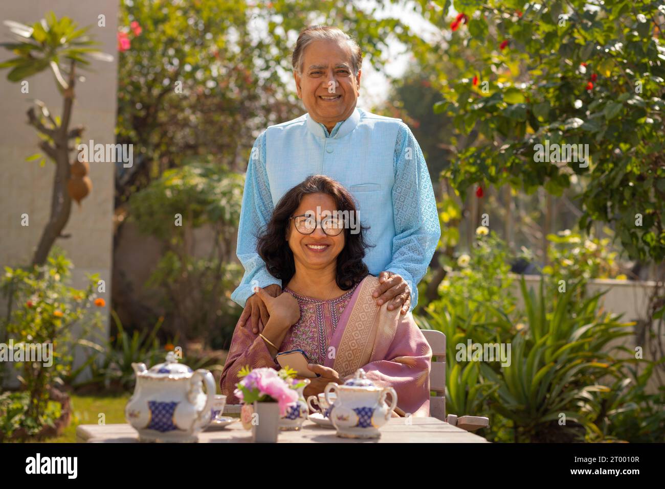 Mature couple spending their time together in garden Stock Photo