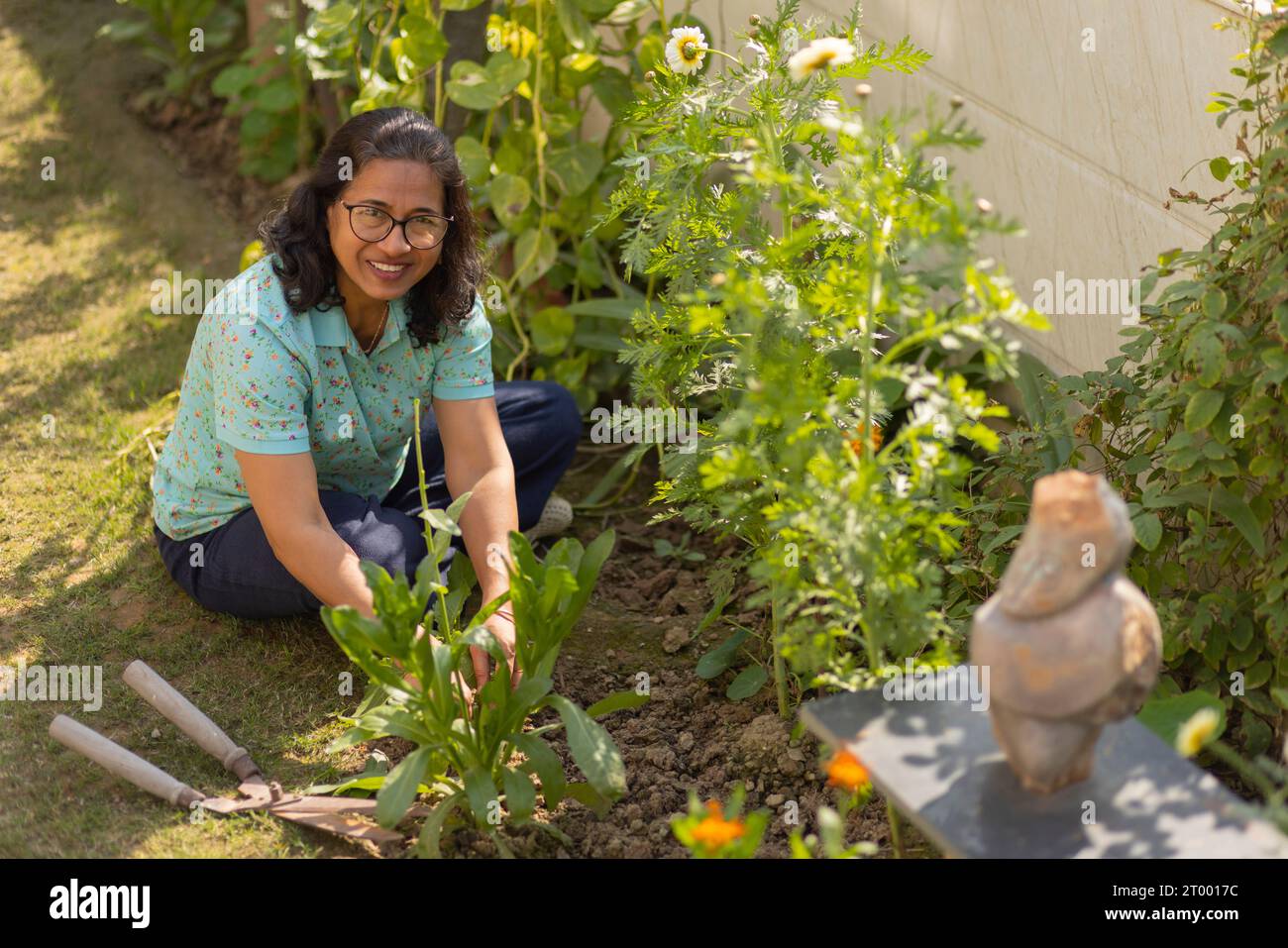 Top view of happy senior woman gardening at home Stock Photo