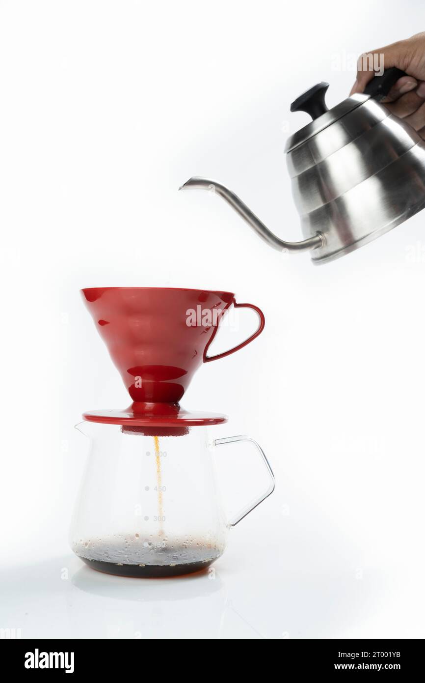 Serves coffee with a V60 dripper coffee maker on a white background Stock Photo