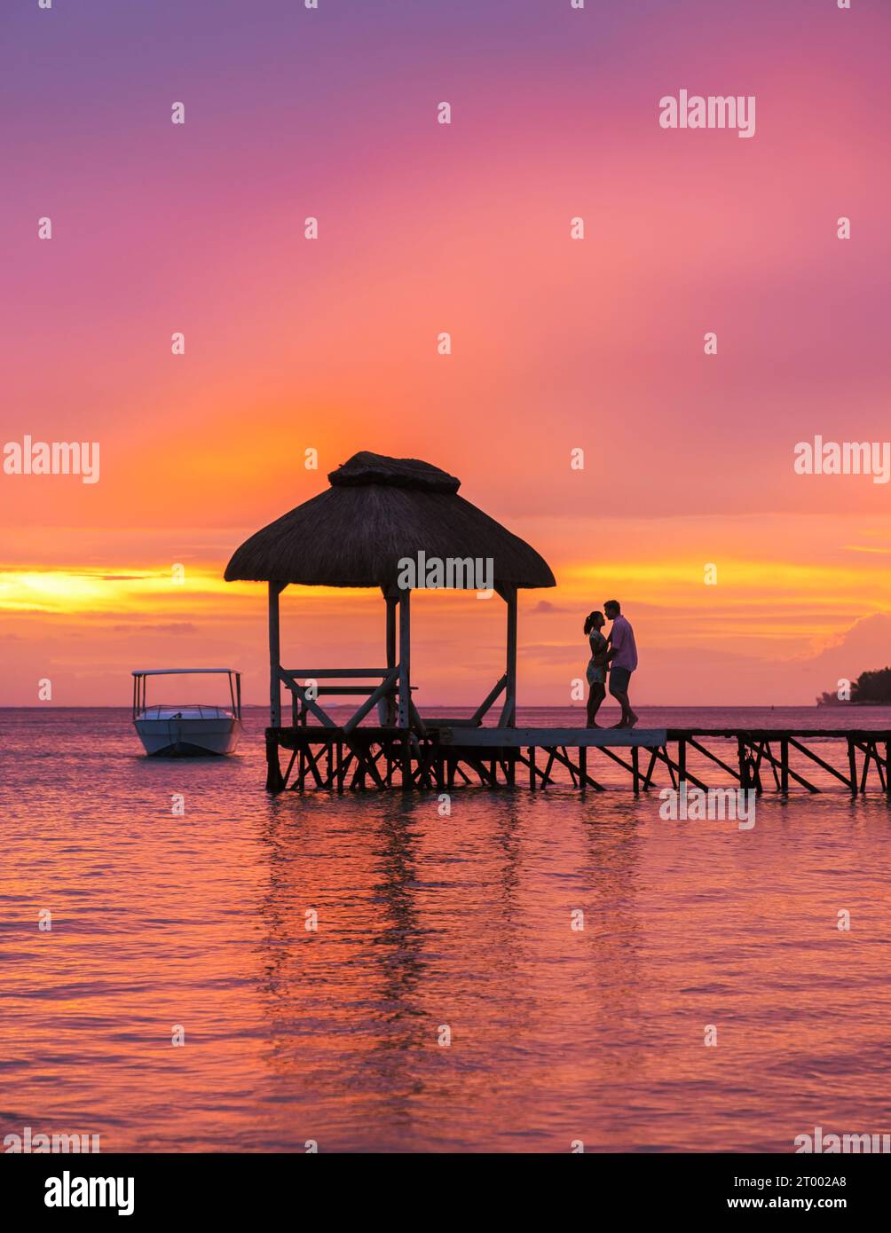 Man and Woman on a tropical beach in Mauritius, a couple on honeymoon ...