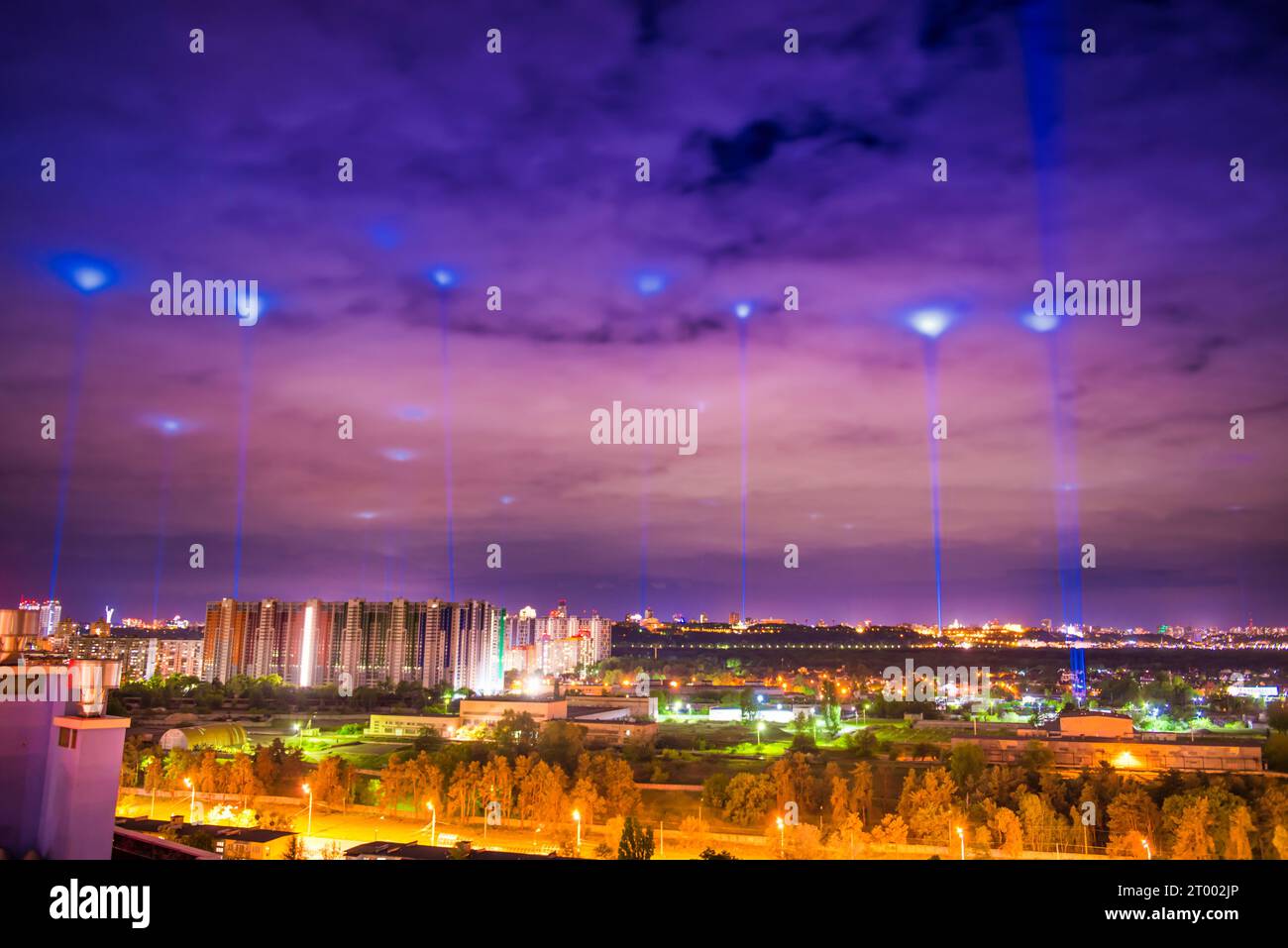 Night illuminated city with blue lights Stock Photo - Alamy