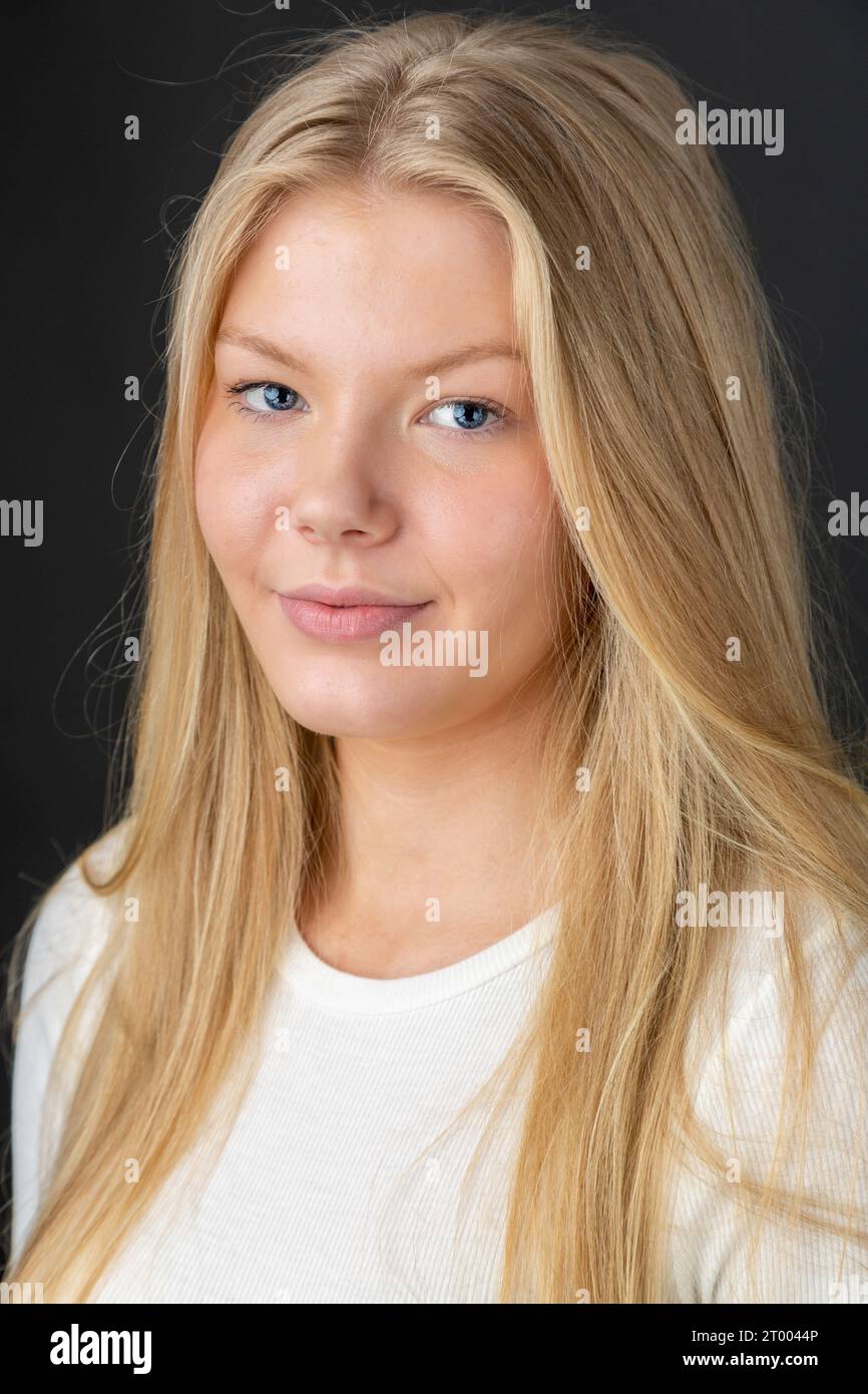 Beauty portrait of a young 18 year old woman with long blonde hair Stock Photo