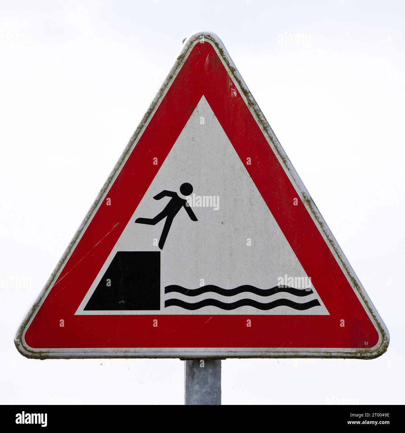 Sign warns people not to fall off the edge into the water, harbour, Leer, Germany, Europe Stock Photo