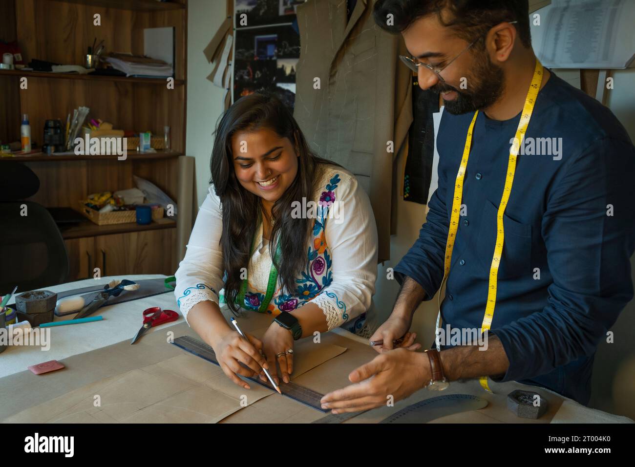 Fashion designers working on patterns in their studio Stock Photo - Alamy