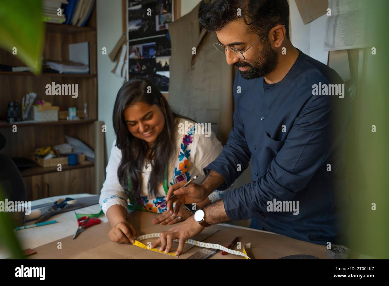 Fashion designers working on patterns in their studio Stock Photo - Alamy
