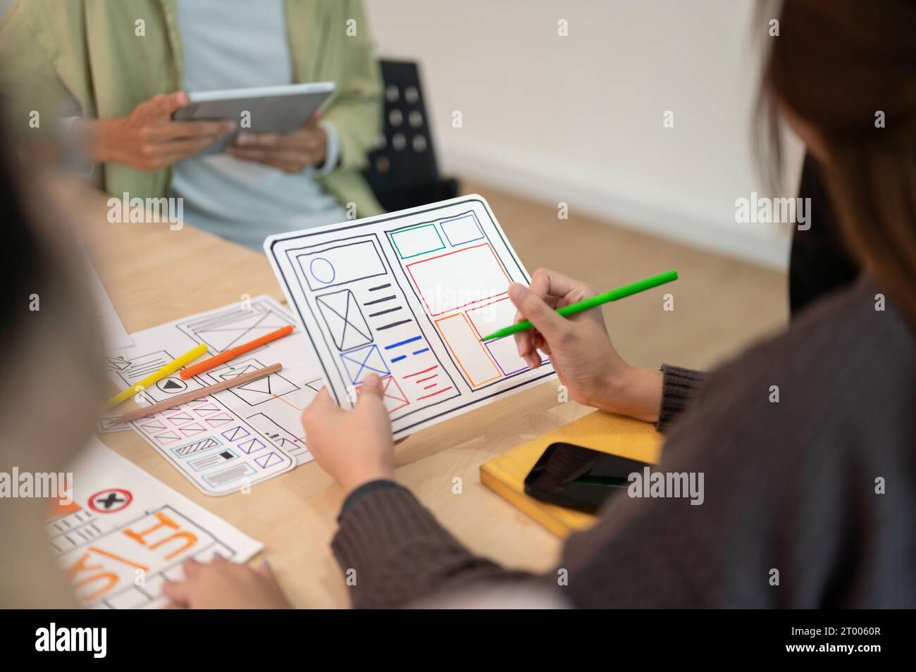 Close up view of young professional UX UI designer discussion on their ...