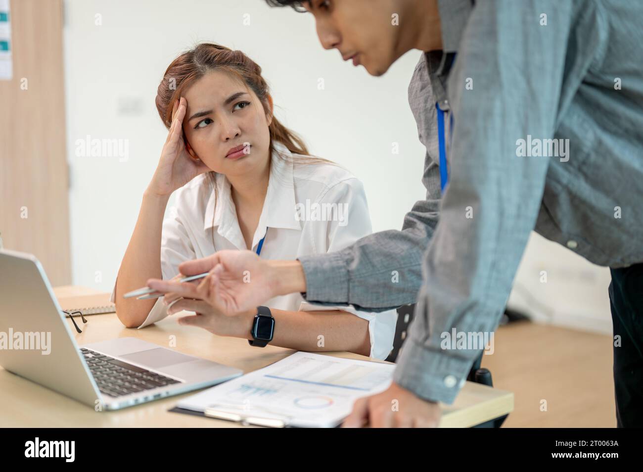 Professional businesswoman focusing with her coworker, trying to ...