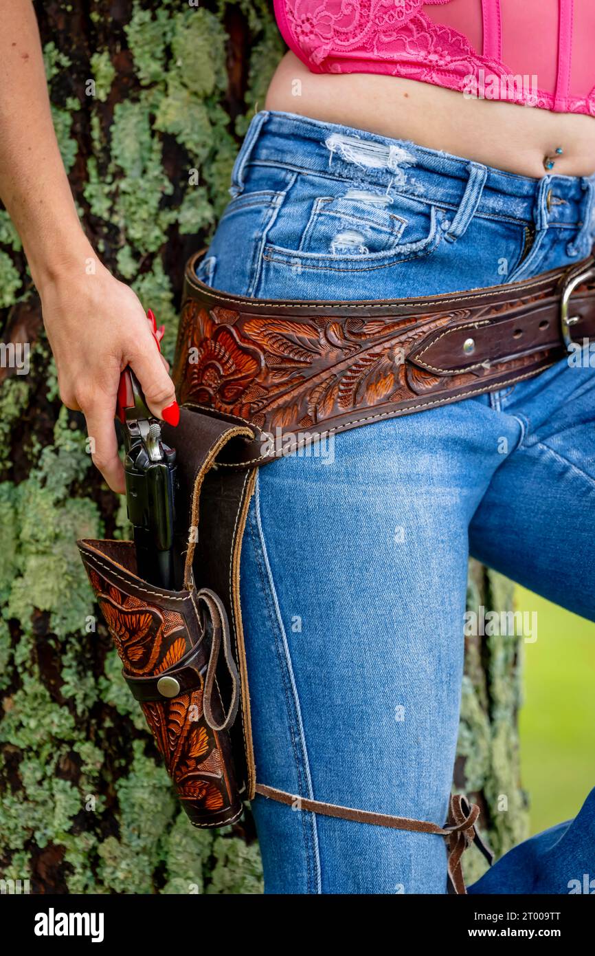 A Lovely Red Headed Country Wetern Model Poses Outdoors In A Country Setting Stock Photo