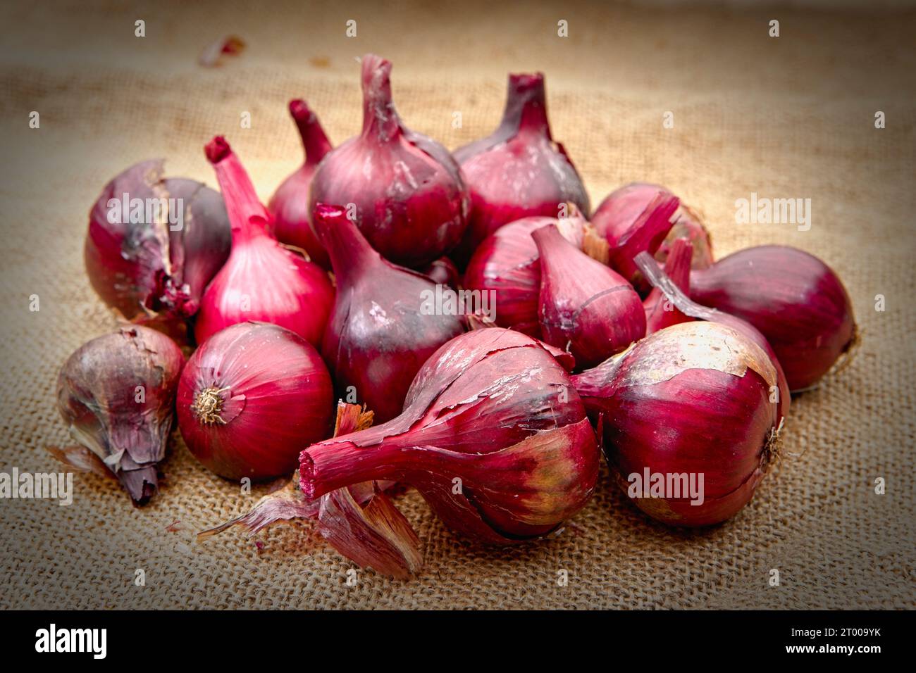 Premium Photo  Fresh red onions in bag on wooden