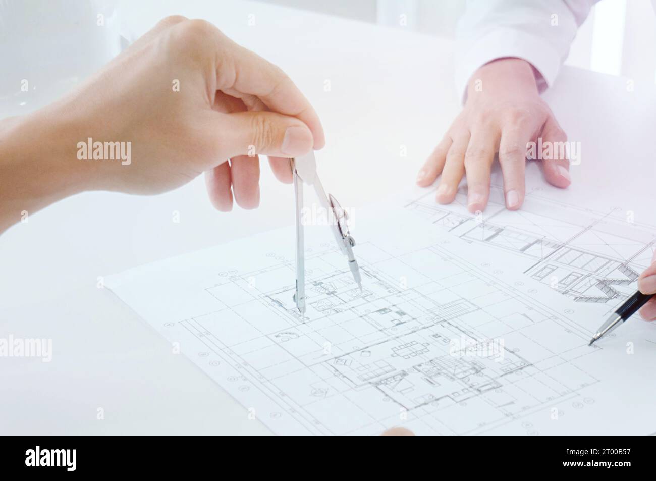 Colleagues interior designer Corporate Achievement Planning Design on blueprint Teamwork Concept with compasses. Stock Photo