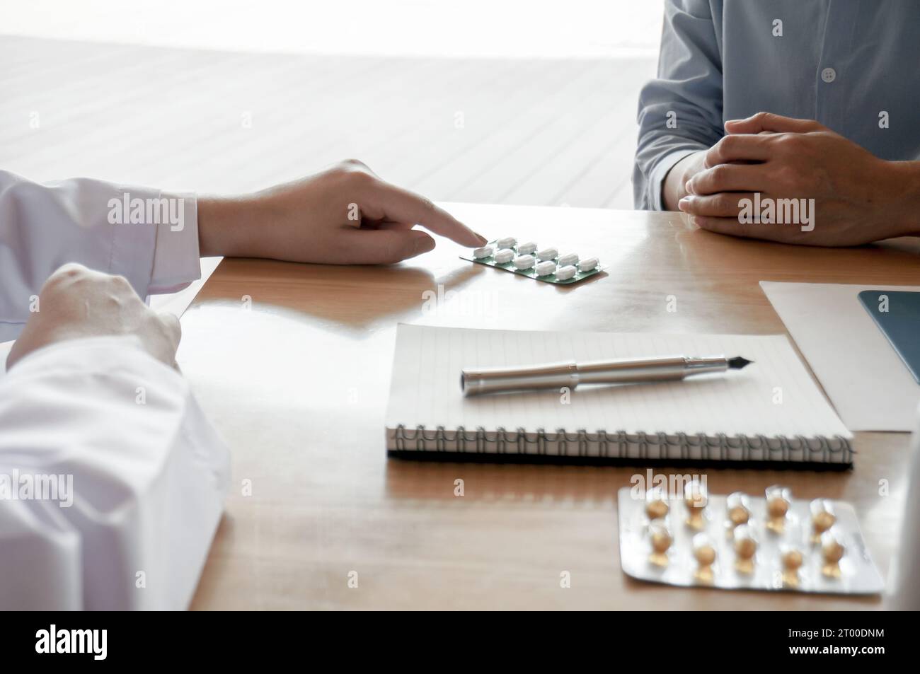 Health care Doctor giving medicine to patient for arthritis pain Stock