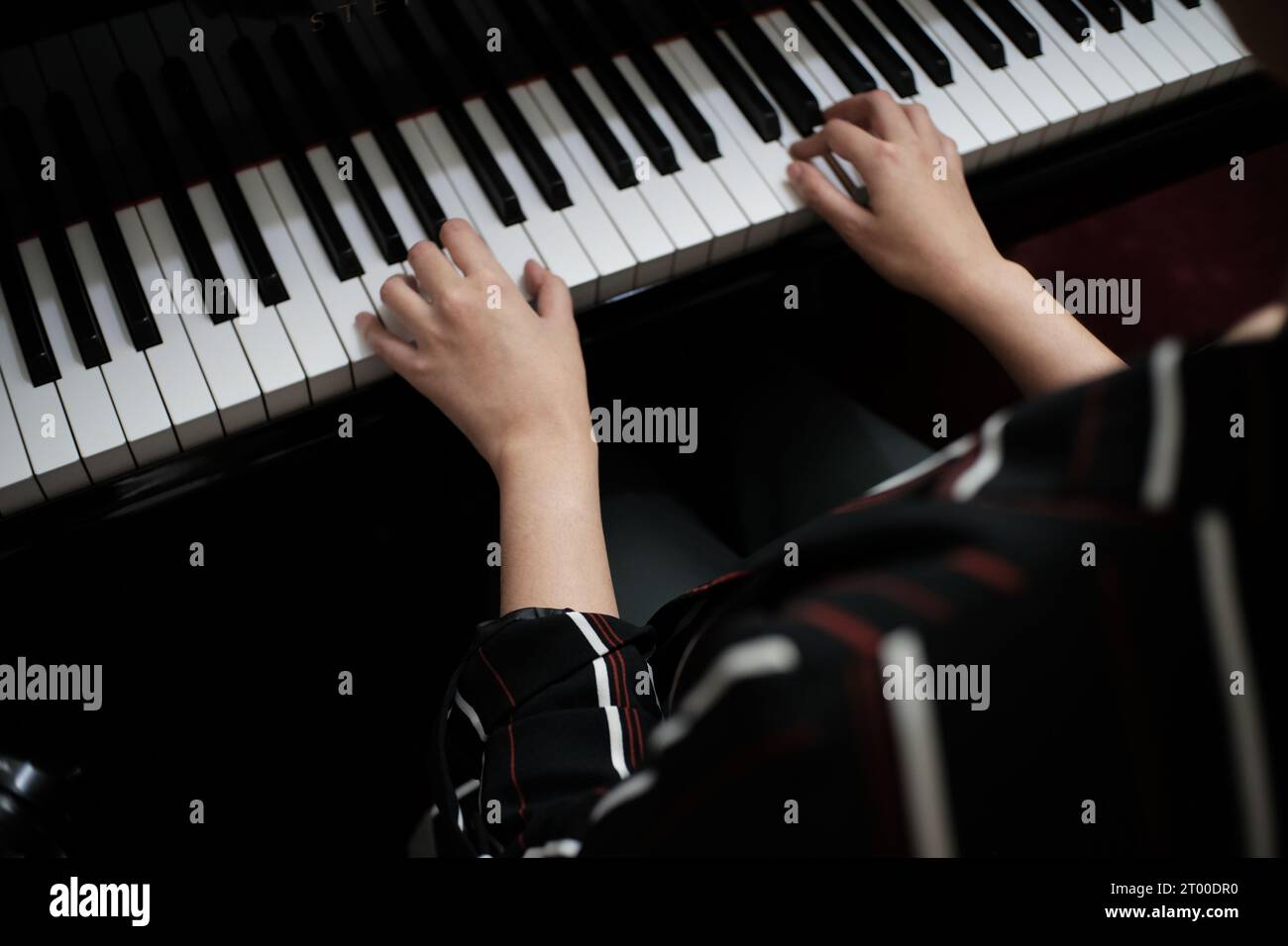 Beautiful asian girl learn to play piano. Stock Photo