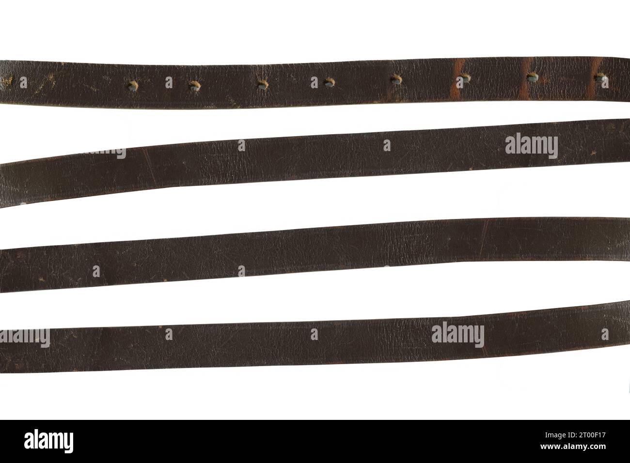 A set of worn leather strips on a white background. leather belt Stock Photo Alamy