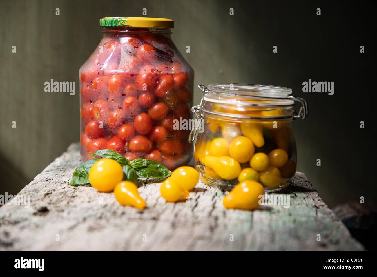 red and yellow cherry tomatoes in a jar for winter Stock Photo - Alamy