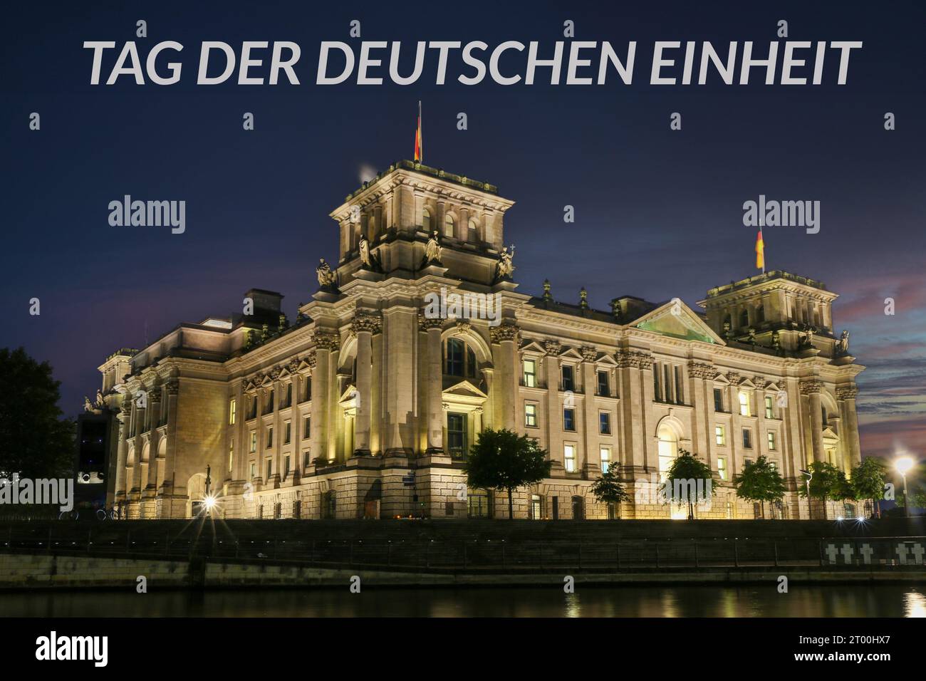 The Reichstag in Berlin at night with the german text TAG DER DEUTSCHEN EINHEIT (Day of german unity), Composing Stock Photo