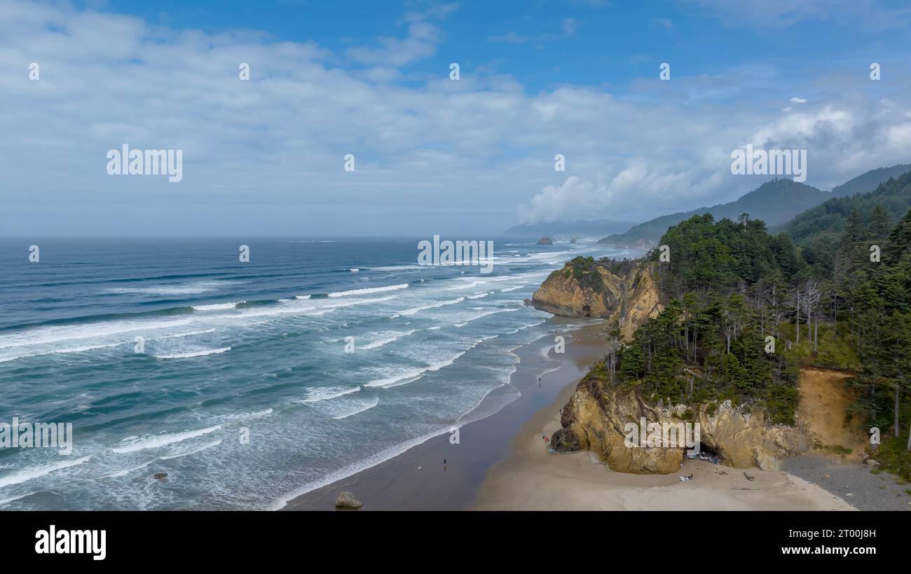 Aerial View Of A Set Of Waves Crashing Into A Beach On The Oregon Coast Stock Photo