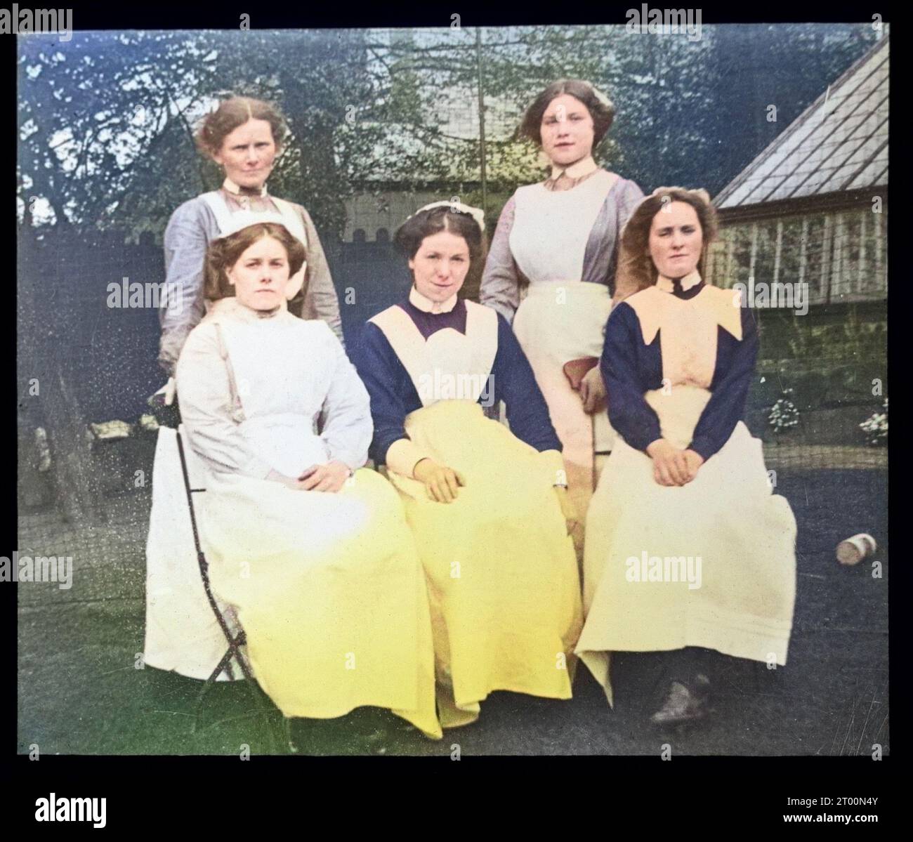 Group portrait of female domestic staff nursemaids servants, British social history c 1900, 1910s, 1920s, 1930s colourised Stock Photo